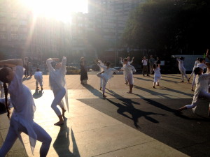Dancers pose next to pedestrians in the first movement of the Table of Silence Tribute on September 11th, 2013.