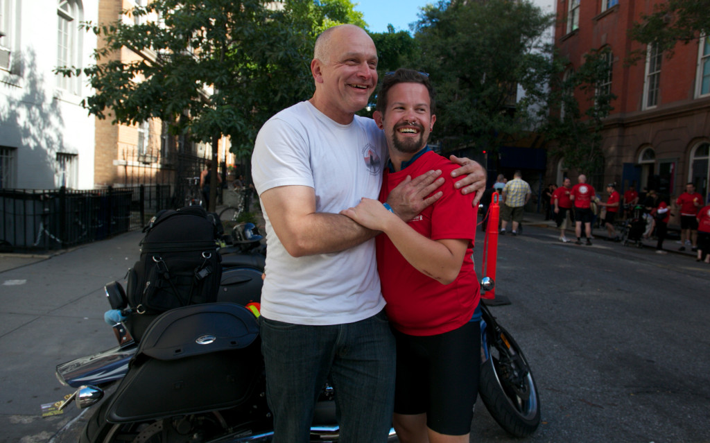 Jim Tate, 50, embraces his boyfriend Andy Tonken, 26. Tonken said that although recent anti-gay attacks are"terrible," he does not feel unsafe in New York.