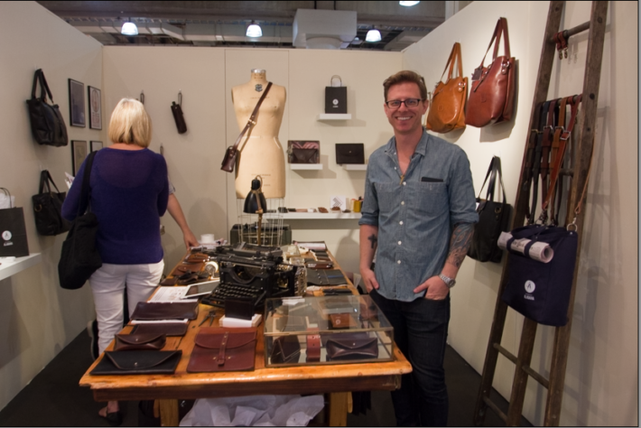 Dana Glaeser stands in front of the Slightly Alabama booth at the NY Now Trade Show.