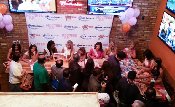 2016 Hooters Swimsuit Calendar Girls signing calendars in the lobby of Hooters Manhattan location on W 33rd Street. Photo by: Christine Trudeau 