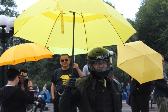 Marcus Lee, 35, holds up an yellow umbrella at the New Yorkers for Hong Kong demonstration on Sept. 27 in Union Square. The demonstration marks the first anniversary of the Umbrella Movement, which advocates for universal suffrage.