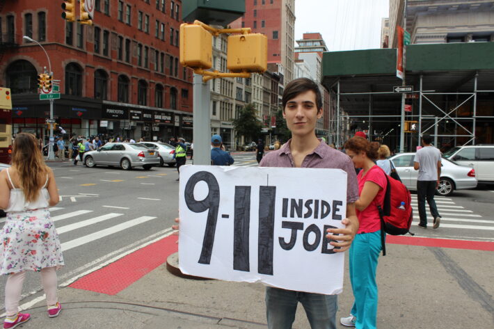 Chris Dimartini from New Jersey planned to walk the streets of New York City with his sign before the Chelsea explosion on Saturday night. 