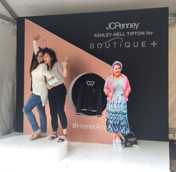 Fans pose in the photo booth during the all-day fashion event in Greeley Square Park.