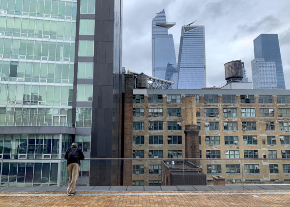 A visitor looks out into Chelsea and Hudson Yards from the sixth-floor terrace