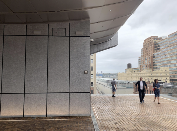 Visitors walk around the sixth-floor outdoor terrace at the Pace Gallery