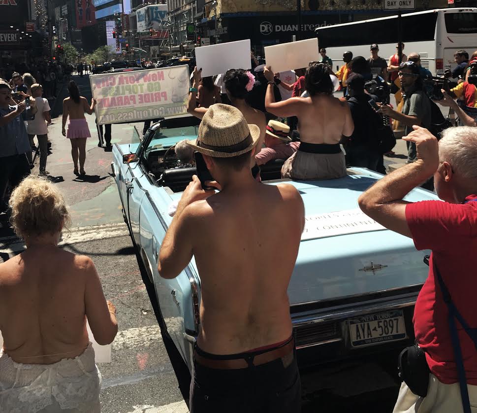 Topless protesters march for equal rights in Midtown